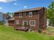 Charming home featuring a spacious backyard with a deck, perfect for outdoor entertaining at 893 Sandune Dr, Norcross, GA 30093