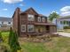 Inviting two-story home featuring stone accents, attached garage, and lush front yard landscaping at 893 Sandune Dr, Norcross, GA 30093