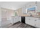Kitchen with granite countertops, white cabinets, and stainless steel appliances at 893 Sandune Dr, Norcross, GA 30093