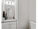 Powder room with a granite countertop and a vanity at 1025 Taylor Oaks Dr, Roswell, GA 30076