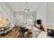 Bright living room with high ceilings, a fireplace, staircase, and modern decor at 1025 Taylor Oaks Dr, Roswell, GA 30076