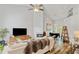 Bright living room with high ceilings, a fireplace, and dining area view at 1025 Taylor Oaks Dr, Roswell, GA 30076