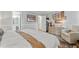 A stylish bedroom featuring a dresser, wall art and chair at 1025 Taylor Oaks Dr, Roswell, GA 30076