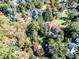 Expansive estate surrounded by mature trees, highlighting the property's size and privacy in a wooded setting at 15 Cherokee Nw Rd, Atlanta, GA 30305