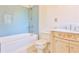 Cozy bathroom featuring a tiled tub and shower and a classic vanity at 15 Cherokee Nw Rd, Atlanta, GA 30305
