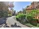 Elegant driveway leading to a beautiful home surrounded by lush landscaping at 15 Cherokee Nw Rd, Atlanta, GA 30305