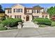 Charming facade with manicured landscaping and a welcoming entrance with stone steps and potted plants at 15 Cherokee Nw Rd, Atlanta, GA 30305