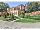Stately home with manicured lawn, mature landscaping, and inviting stone walkway at 15 Cherokee Nw Rd, Atlanta, GA 30305