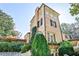 Elegant exterior showcasing the architecture, garden, and beautiful landscaping at 15 Cherokee Nw Rd, Atlanta, GA 30305