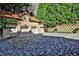 Spacious three-car garage with a patterned stone driveway and manicured landscaping at 15 Cherokee Nw Rd, Atlanta, GA 30305