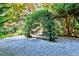 Enchanting garden swing under a leafy arch, creating a serene retreat at 15 Cherokee Nw Rd, Atlanta, GA 30305