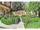 Scenic garden featuring lush greenery, a stone path, and a charming bench at 15 Cherokee Nw Rd, Atlanta, GA 30305