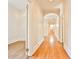 Hallway with hardwood floors and arched doorways, offering a glimpse of the house's layout at 15 Cherokee Nw Rd, Atlanta, GA 30305