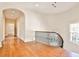 Hallway with hardwood floors and railing, providing an overview of the house's bright interior at 15 Cherokee Nw Rd, Atlanta, GA 30305
