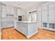 Spacious kitchen featuring custom cabinetry, marble countertops, and a large center island at 15 Cherokee Nw Rd, Atlanta, GA 30305