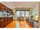 Charming kitchenette with cherry cabinets, hardwood floors, and a seating area at 15 Cherokee Nw Rd, Atlanta, GA 30305