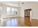 Bright living room with hardwood floors, large windows, and a chandelier, creating an elegant space at 15 Cherokee Nw Rd, Atlanta, GA 30305