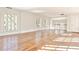 Upstairs living area features hardwood floors and large windows with natural light and a view of the railing at 15 Cherokee Nw Rd, Atlanta, GA 30305