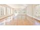 Bright living room featuring hardwood floors and large windows with natural light and outdoor views at 15 Cherokee Nw Rd, Atlanta, GA 30305