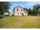 Expansive backyard with lush greenery, a well-maintained lawn, mature trees, and a view of the house at 2730 Milton Bryan Dr, Loganville, GA 30052