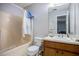 Functional bathroom featuring a shower-tub combination, vanity with sink, and updated fixtures at 2730 Milton Bryan Dr, Loganville, GA 30052