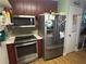 Efficient kitchen featuring stainless steel appliances, compact design, and functional layout at 2730 Milton Bryan Dr, Loganville, GA 30052
