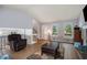 Bright living room featuring hardwood floors, a stone fireplace, and staircase leading to upper level at 2730 Milton Bryan Dr, Loganville, GA 30052