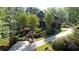 Aerial view of a gorgeous home with lush landscaping, surrounded by mature trees, offering a secluded retreat at 310 Anders Path, Marietta, GA 30064