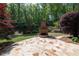Spacious stone patio with a wood burning brick fireplace at 310 Anders Path, Marietta, GA 30064