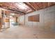 Unfinished basement with exposed wood framing and concrete walls ready for customization at 310 Anders Path, Marietta, GA 30064