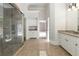 Large bathroom featuring a glass enclosed shower, granite countertops, and linen storage at 310 Anders Path, Marietta, GA 30064
