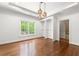 Bedroom with hardwood floors, an attached walk-in closet, and an attached bathroom at 310 Anders Path, Marietta, GA 30064