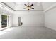 Large bedroom with a balcony, tray ceiling and an open view to another room at 310 Anders Path, Marietta, GA 30064