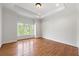 Bedroom features hardwood floors, neutral walls, and large windows at 310 Anders Path, Marietta, GA 30064