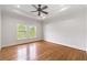 Bedroom features hardwood floors, neutral walls, and large windows offering natural light at 310 Anders Path, Marietta, GA 30064