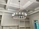 Contemporary chandelier illuminates the room, enhancing the ambiance with its unique design and soft, inviting light at 310 Anders Path, Marietta, GA 30064