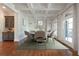 Dining room boasts coffered ceilings, natural light, and a gray built-in cabinet at 310 Anders Path, Marietta, GA 30064