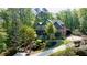 Charming two-story brick home surrounded by mature trees and professionally landscaped grounds at 310 Anders Path, Marietta, GA 30064