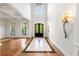 Bright foyer with high ceilings, hardwood floors, elegant lighting, and large windows at 310 Anders Path, Marietta, GA 30064