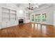 Living room featuring fireplace, built-in bookshelves, and hardwood floors at 310 Anders Path, Marietta, GA 30064