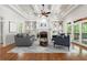 Cozy living room with fireplace, built-in bookshelves, and access to a deck at 310 Anders Path, Marietta, GA 30064