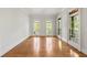Sunlit living room with hardwood floors and access to balcony at 310 Anders Path, Marietta, GA 30064
