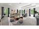 Living room with ample light, trey ceilings, neutral decor, and a comfortable seating arrangement at 310 Anders Path, Marietta, GA 30064