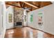 Bright living room boasts stone fireplace and wood beam ceiling at 310 Anders Path, Marietta, GA 30064