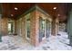 Charming outdoor patio with brick, stone, and exposed wood features and outdoor lighting at 310 Anders Path, Marietta, GA 30064