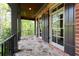 Brick porch boasts decorative columns and outdoor views at 310 Anders Path, Marietta, GA 30064