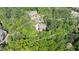 Aerial view illustrating the property boundaries of a wooded lot, featuring a residence with a private driveway at 310 Anders Path, Marietta, GA 30064