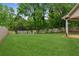 Large, green backyard featuring a privacy fence and ample space for recreation and relaxation at 672 Bostonian Way, Lawrenceville, GA 30046