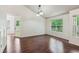 Dining area featuring hardwood floors, natural light, and access to the backyard at 672 Bostonian Way, Lawrenceville, GA 30046