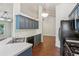 Well-lit kitchen featuring blue-gray cabinets, white countertops, and black appliances at 672 Bostonian Way, Lawrenceville, GA 30046